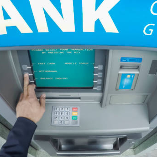Man making withdrawal and choosing from screen display menu.